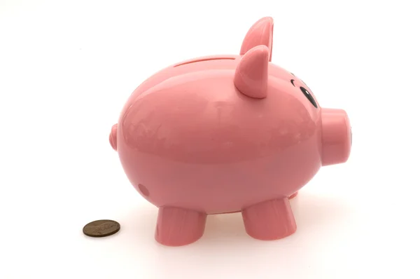 Piggy Bank cagando um centavo — Fotografia de Stock