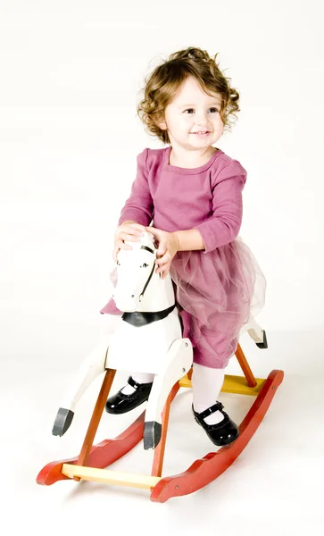 Baby Girl on Rocking Horse — Stock Photo, Image