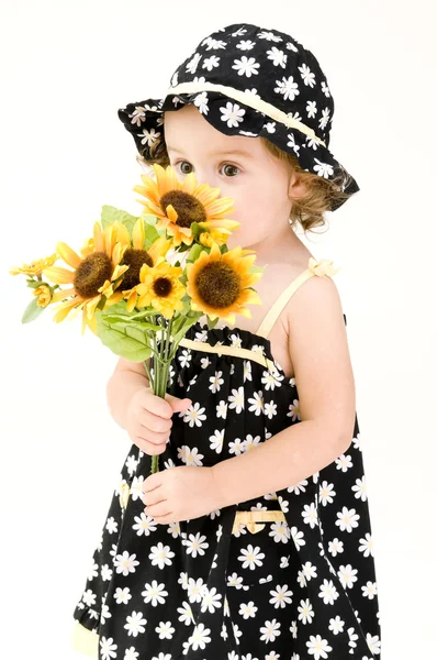 Portrait of baby girl with flowers — Stock Photo, Image
