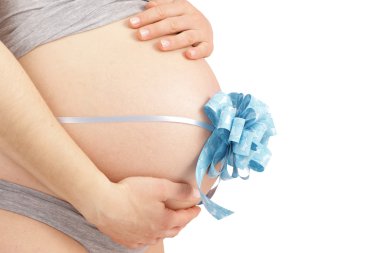 Pregnant woman embracing her belly clipart