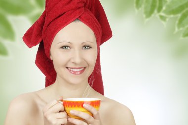 Young woman with towel drinking tea clipart