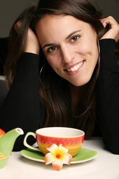 Woman with a cup of hot tea — Stock Photo, Image