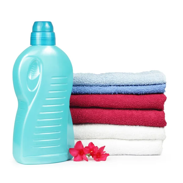 Towels and liquid laundry detergent — Stock Photo, Image