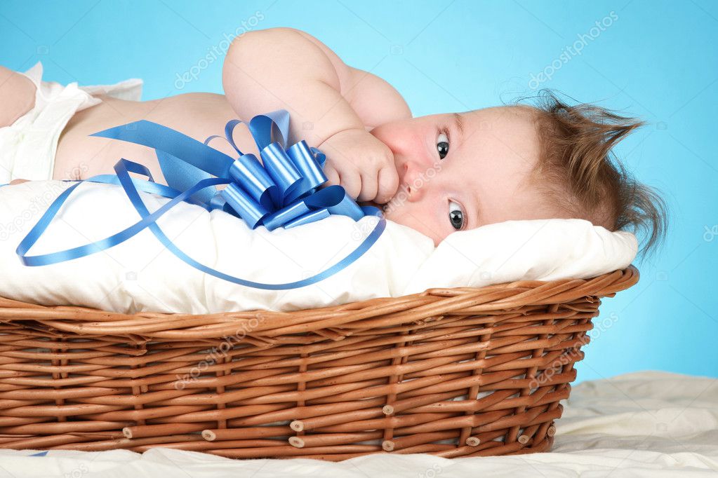 Adorable baby in wicker basket