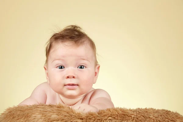 Adorable baby on fur blanket — Stock Photo, Image