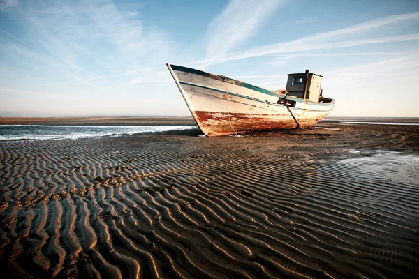 stock image Aground boat on the beach