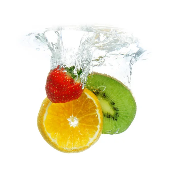 Fruit dropped in the water — Stock Photo, Image