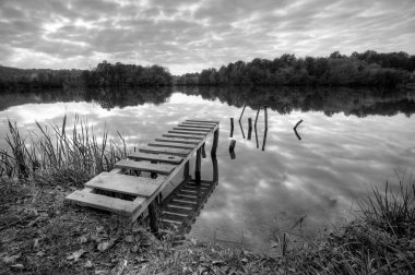 Landspace photo of still lake in black and white clipart