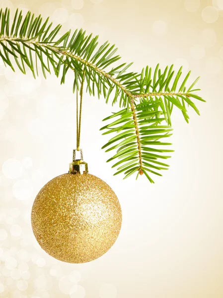 Golden christmas bauble on a string — Stock Photo, Image