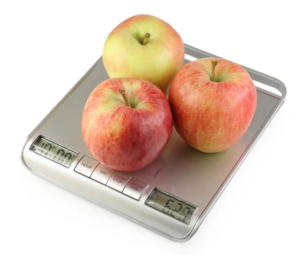 Três maçãs em escala de cozinha — Fotografia de Stock