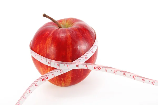 Fita métrica e uma maçã — Fotografia de Stock