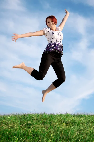 Mujer saltando Imagen de archivo