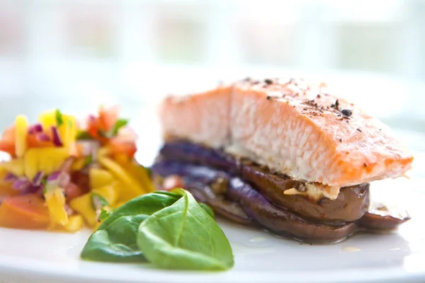 Baked salmon on bed of grill aubergine — Stock Photo, Image