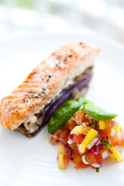 Baked salmon on sauteed aubergine with salsa — Stock Photo, Image