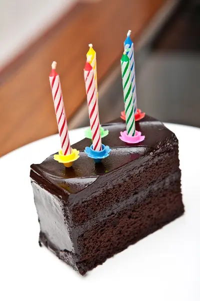 stock image Delicious chocolate fudge cake with candles