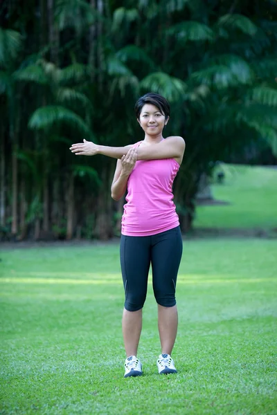 Active woman doing stretching exercise — Stock Photo, Image