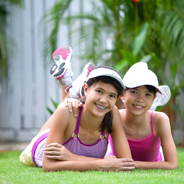 Two sisters in sporty clothes — Stock Photo, Image