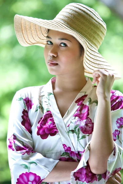 stock image Young Asian woman with straw hat