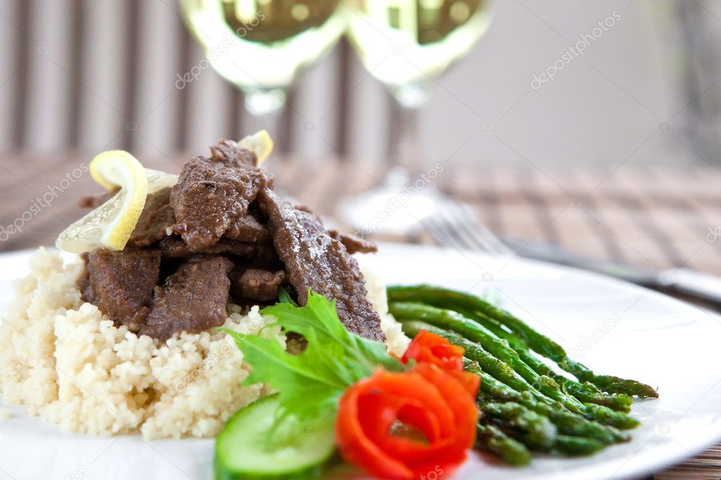 Delicious lamb cous cous with grilled asparagus