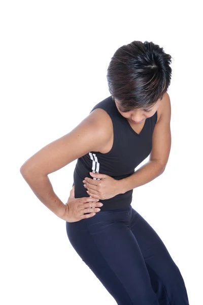 Женщина страдает от боли в спине — стоковое фото