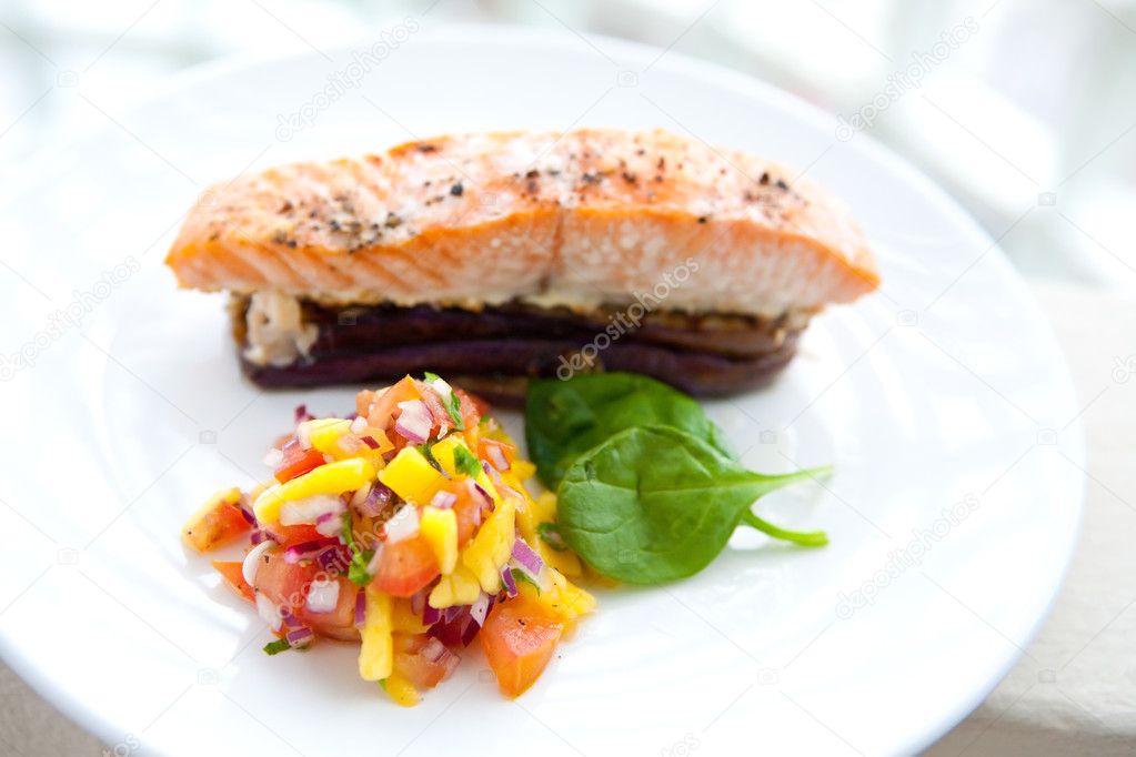 Baked salmon on bed of grill aubergine with serving of salsa