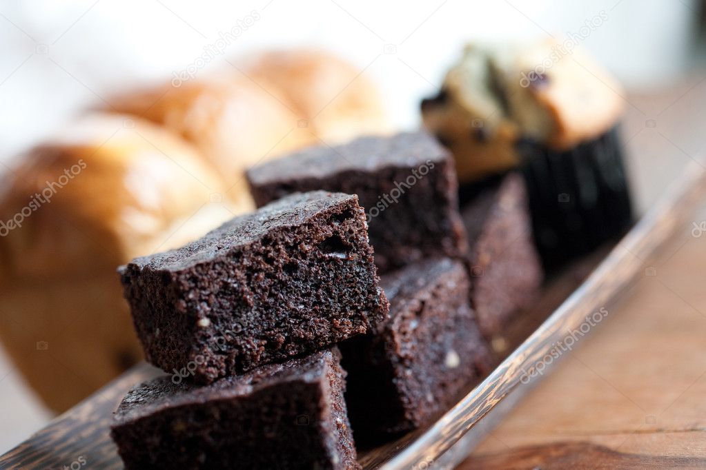Chocolate brownies, muffin and loaf of sweet bread