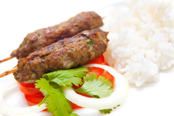 stock image Delicious lamb seekh kebabs served with rice and tomatoes