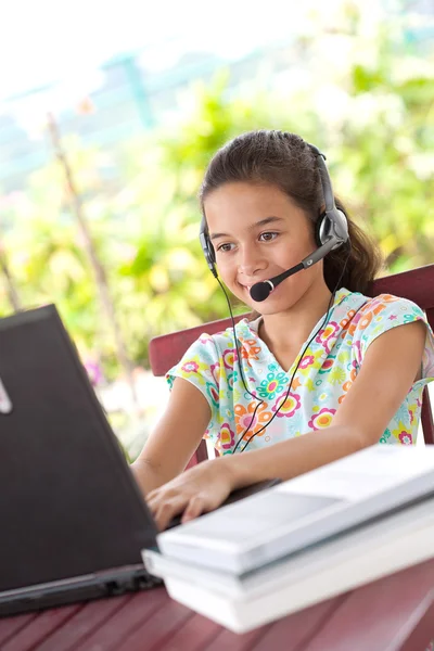 stock image Beautiful young girl doing her homework in a home environment