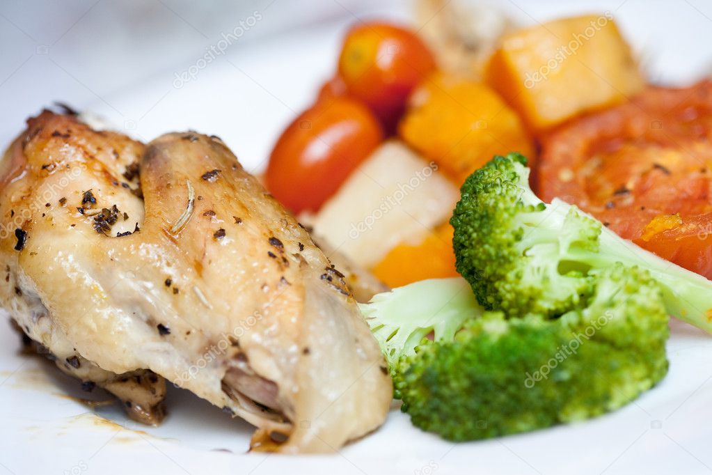 Delicious roast chicken with broccoli and roasted vegetables