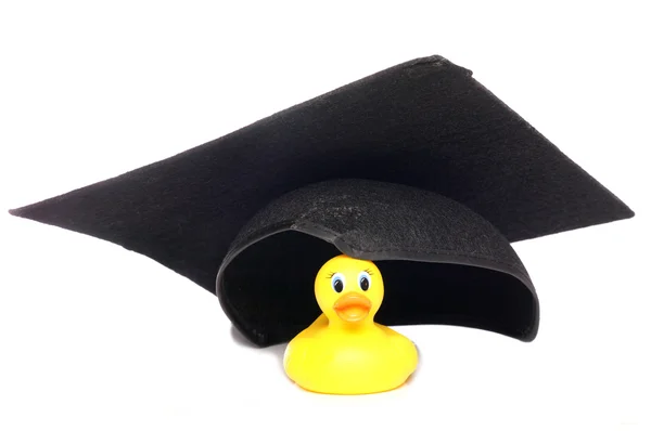 Gele rubber duck dragen van een hoed mortel bestuur — Stockfoto