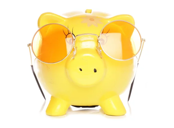 Yellow piggybank with sunglasses — Stock Photo, Image