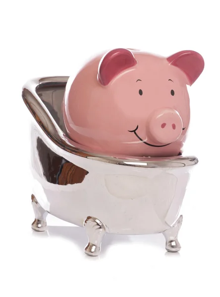 Piggybank i ett bad — Stockfoto