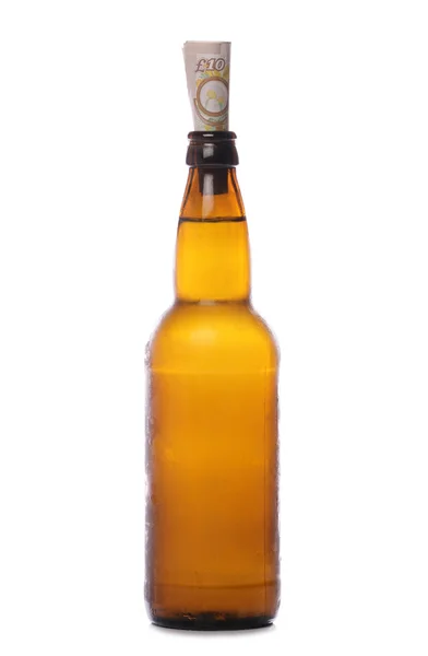 Beer bottle with money — Stockfoto