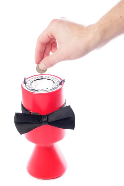Black bow tie charity giving pound coin donation — Stock Photo, Image