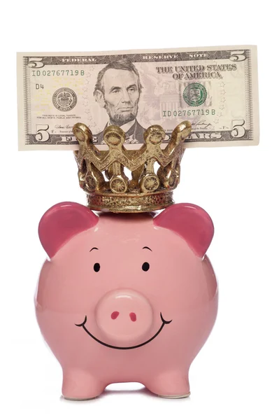Rei Piggybank com cinco dólares — Fotografia de Stock