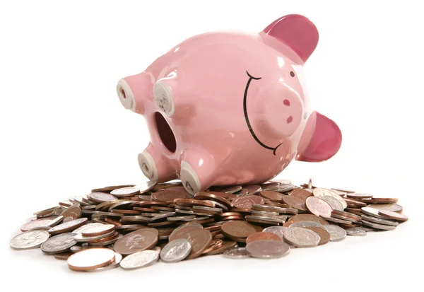 Piggy bank moneybox met Britse muntstukken — Stockfoto