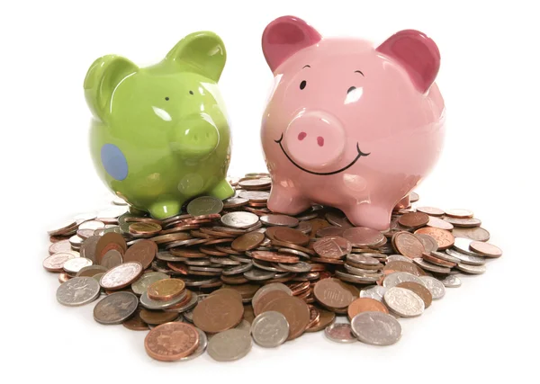 Piggy bank moneybox with British currency coins — Stock Photo, Image