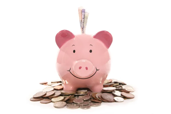 Piggy bank moneybox met Britse valuta geld — Stockfoto