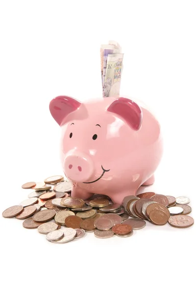Piggy bank moneybox with British currency money — Stock Photo, Image