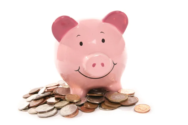 Sparschwein mit britischem Geld — Stockfoto