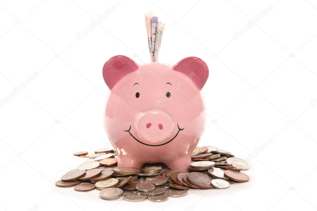 Piggy bank moneybox with British currency money