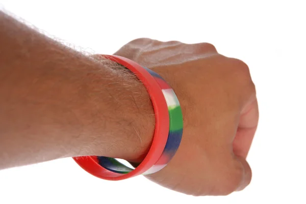 Charity wristbands on wrist cutout — Stock Photo, Image