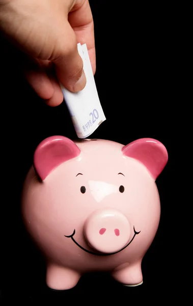 Zwanzig Euro im Sparschwein sparen — Stockfoto