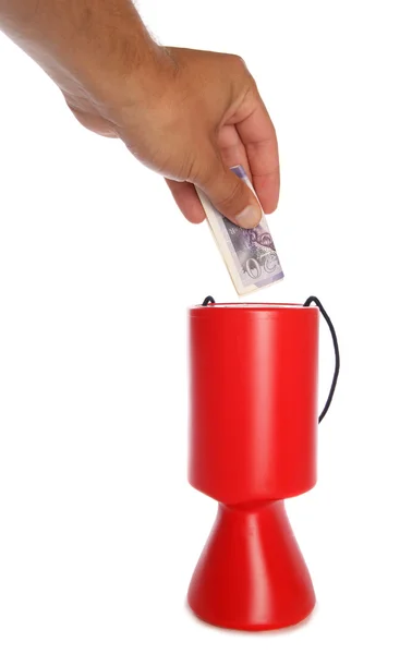 Man donating twenty pounds to charity — Stock Photo, Image