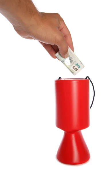 Man donating five pounds to charity — Stock Photo, Image