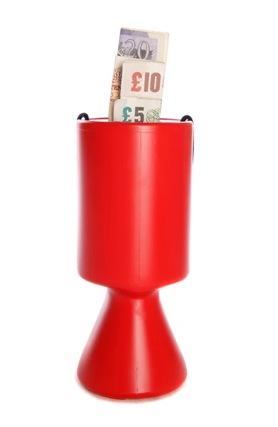 Charity collection with sterling money — Stock Photo, Image