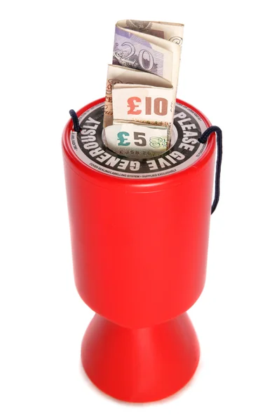 Charity collection with sterling money — Stock Photo, Image