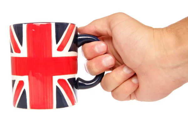 Hand holding Britse mok — Stockfoto