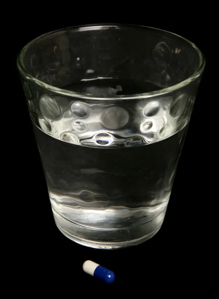 Glas vand og medicin - Stock-foto