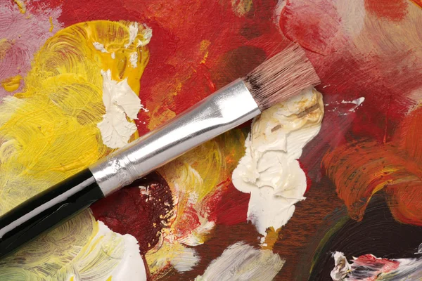 Artysta palety z farby szczotka tło — Zdjęcie stockowe